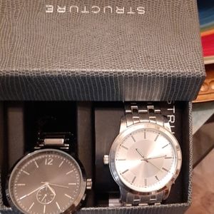 2 men watches 1 black 1 silver colored